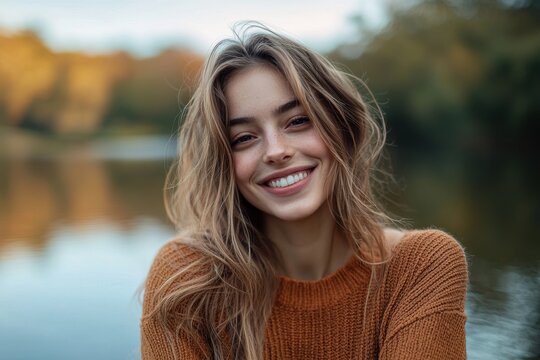 Image of a cheerful girl by a body of water