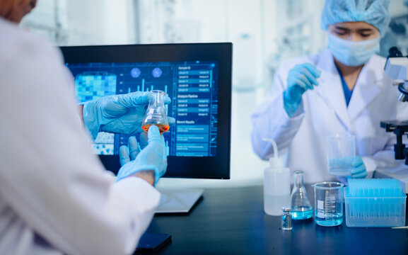 Medical team having a meeting with doctors. Young scientists conducting research investigations in a medical laboratory