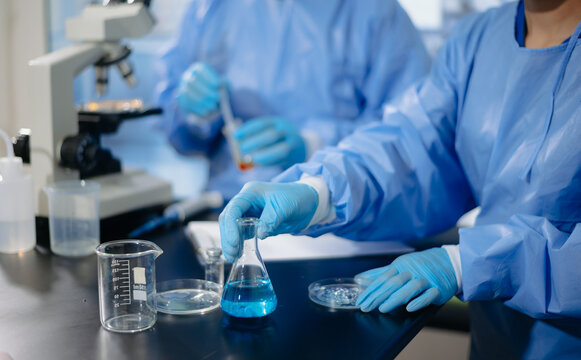 Medical team having a meeting with doctors. Young scientists conducting research investigations in a medical laboratory