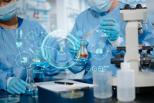Medical researchers using pipettes, flasks, and advanced futuristic digital HUD graphics in laboratory research facility.