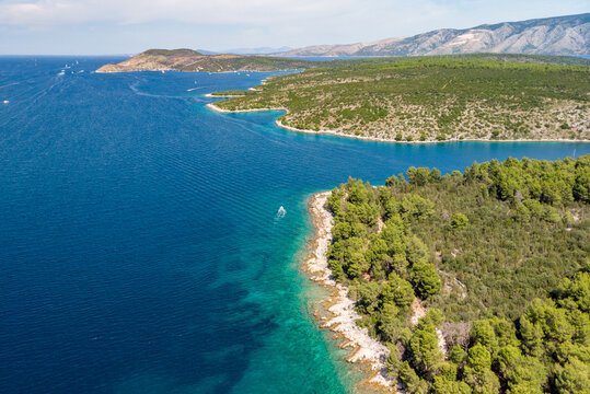Aerial view of the island of Hvar in Croatia. A bay of the Adriatic Sea in Dalmatia. The forests and coast of Hvar in summer. The azure sea on a sunny day.
