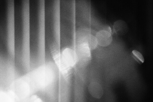 retro film overlay effect with scratch dust and light leaks, retro grain noisy film distressed texture light leak flare on black background, Black and white background