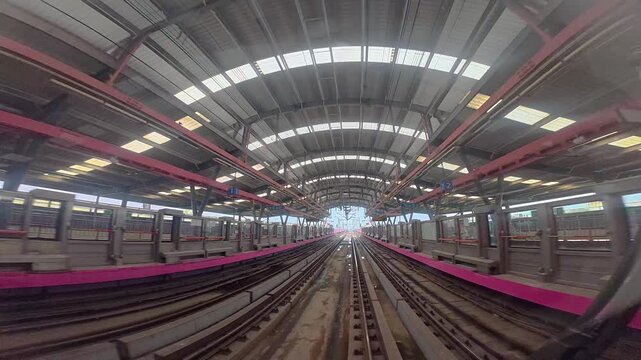 Title: The view from the last coach of a driverless metro train and a video created by reversing the footage.