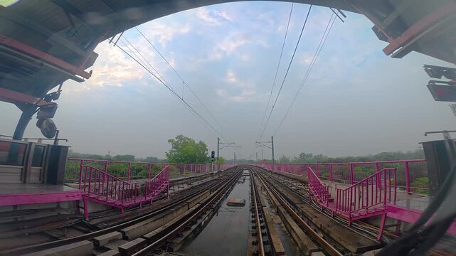 Title: The view from the last coach of a driverless metro train and a video created by reversing the footage.