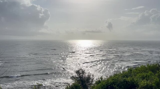 Scenic elevated view of ocean waves under soft evening sunlight from Chapora Fort in North Goa India