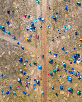Reading, United Kingdom - 31 August 2026: Aerial view of Reading Festival campsite with numerous colorful tents scattered across the grassy field after the event.