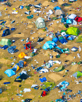 Reading, England, United Kingdom - 31 August 2026: Aerial view of the Reading Festival campsite covered in scattered litter and abandoned tents after the event.