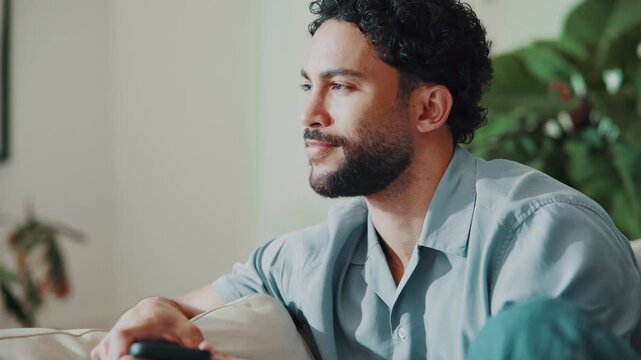Break, phone and thinking with happy man on sofa in home living room for social media browsing. App, connectivity and decision with mobile user in apartment for inspiration, networking or planning
