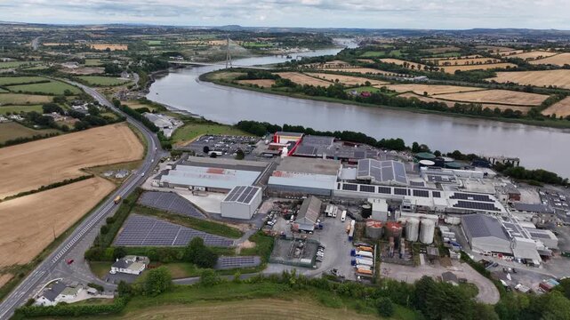 High drone view of meat prccessing plant the River Suir and Waterford City Ireland in the Background amazing aerials