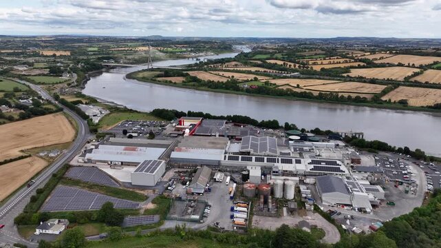 drone orbit meat processing facility at Granagh Kilkenny Ireland with river Suir and Waterford City in Background, with access to the Irish Motorway system