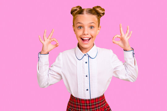 Portrait of her she nice attractive lovely cheerful cheery confident content optimistic pre-teen girl wearing white shirt showing two double ok-sign isolated on bright vivid shine yellow background