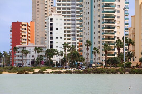 Calpe town in Spain. View with Salines de Calp lagoon. Apartment buildings in Spain.
