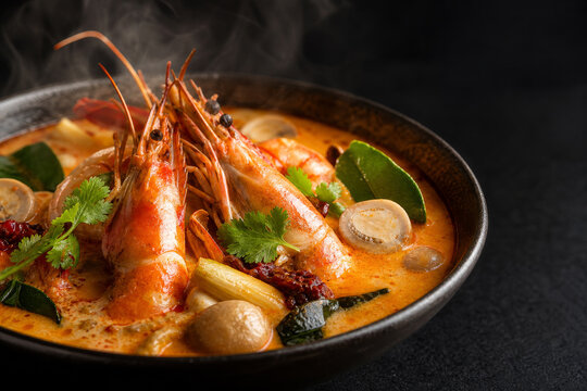 Creamy tom yum goong with prawns and aromatic Thai herbs