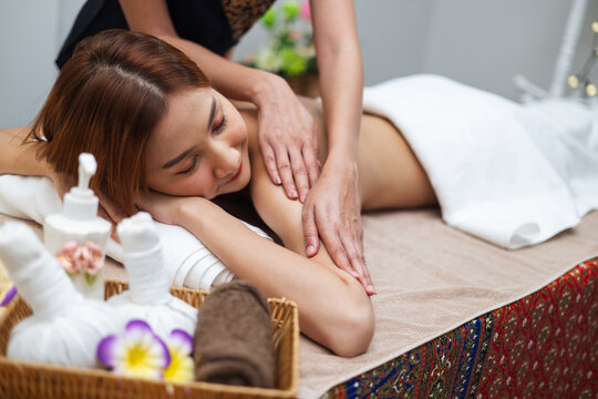 Woman relaxes during gentle shoulder massage