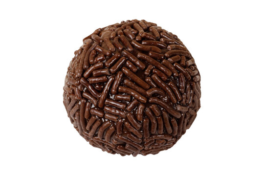 Traditional Brazilian chocolate brigadeiro coated in sprinkles, isolated on a white background.