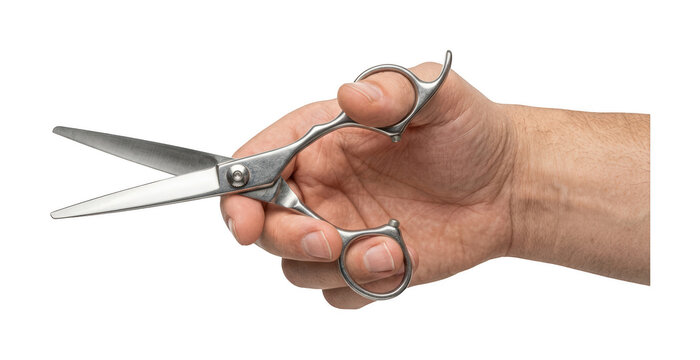 Male hand holding professional metal hair cutting scissors isolated on transparent cutout