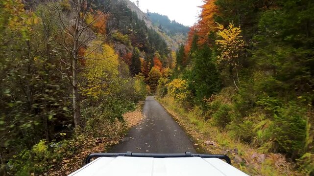 POV of an off-road vehicle driving on a narrow road towards the closed border between Kosovo and Montenegro