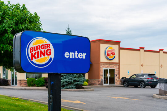 Oneida, NY - July 6, 2026: Selective focus of Burger King entrance sign, maintaining the flashy blue-theme of 1999 till now, an American fast‑food restaurant chain with over 19,000 locations worldwide