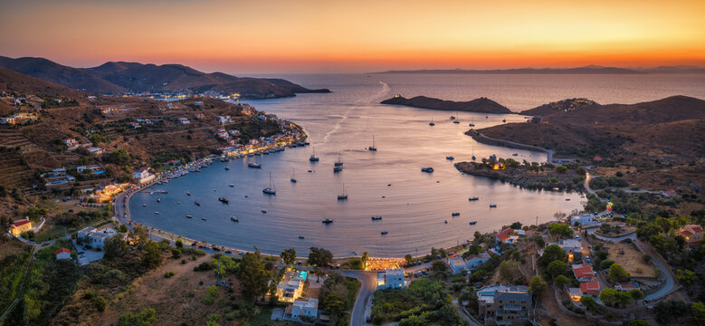 Aerial summer evening view of the bay and beach of Vourkari with numerous moored sailboats at Kea - Tzia island, Cyclades, Greece