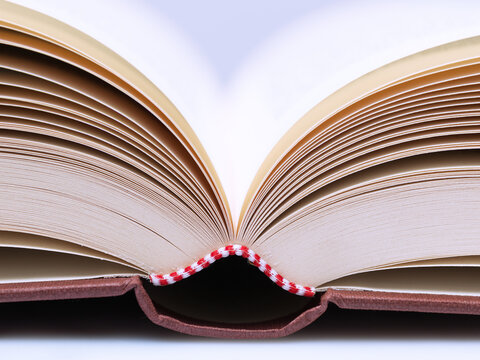 Symmetrical Close Up of Open Hardcover Book Spine