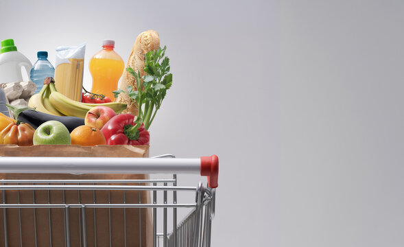 Shopping Cart Filled with Fresh Groceries and Healthy Food
