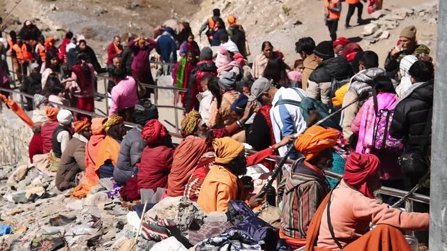 Sadhus and Hindu pilgrims gathered on the stairs at the Muktinath pilgrimage site, Upper Mustang, Nepal