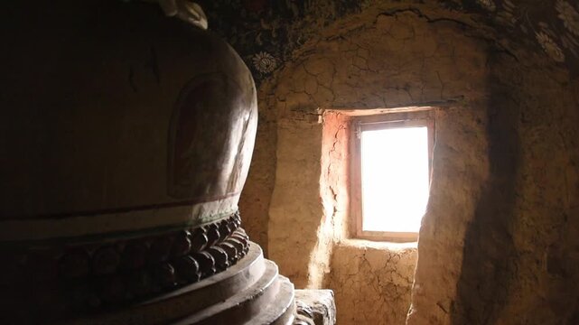 Slow pan over the ancient painted interior of the Luri Gompa cave monastery, Yara, Upper Mustang, Nepal