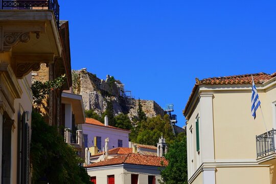 View of traditional architecture, old houses and the Acropolis, in the Plaka neighborhood, in Athens, Greece