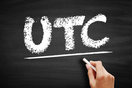 UTC stands for Coordinated Universal Time, the primary time standard by which the world regulates clocks and time, written in chalk on a textured board for educational purposes