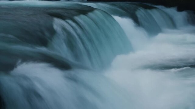 Whitewater chute rushing through a rugged mountain river