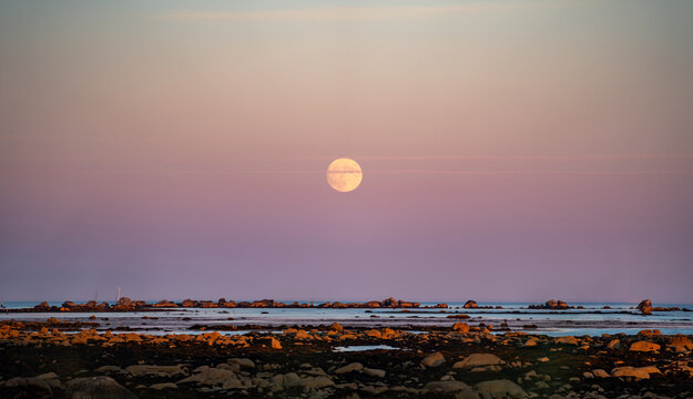 beautiful full moon at the ocean