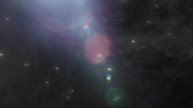 Abstract Dark Background with Colorful Lens Flare and Glowing Particles