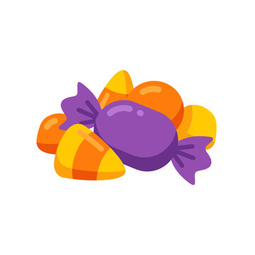 A pile of colorful Halloween candies including wrapped purple candy candy corn and orange spheres.