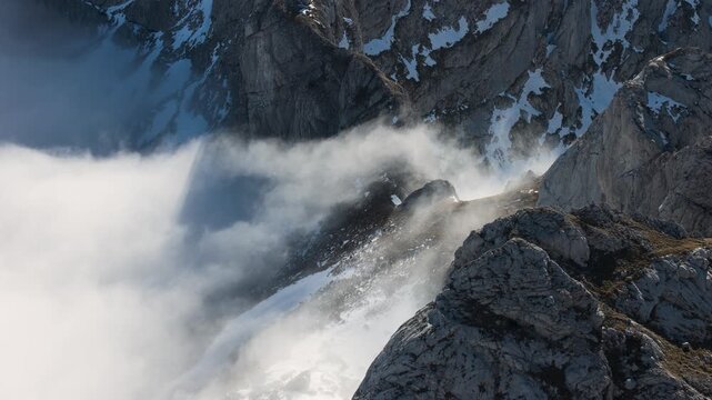 View of clouds rolling over a ridge in Durmitor National Park in Montenegro