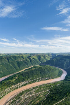 Aerial View of Winding Jing River Flowing Through Green Mountains in Shaanxi Province