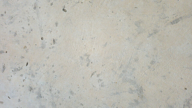 Light gray concrete wall texture with subtle stains, weathered marks, and natural surface variations. The neutral minimalist background provides useful copy space for commercial design projects, archi