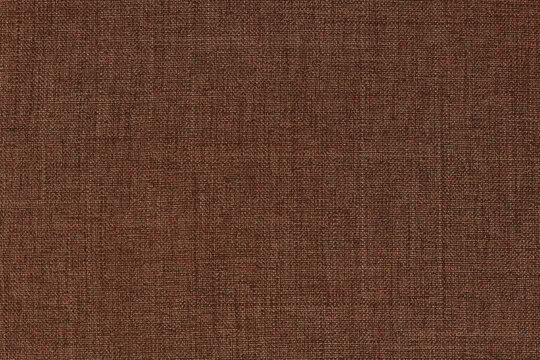Dark brown fabric texture for background and design art work with seamless pattern of natural textile.