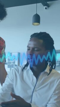Animation of music equalizer over diverse colleagues discussing over computer at office