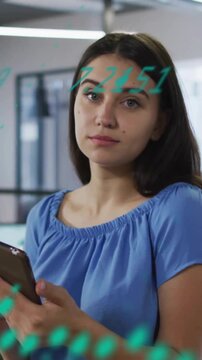 Animation of financial data processing over businesswoman using tablet in office