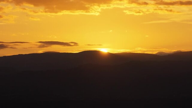 Aerial view of sunset over the rolling hills of the countryside in Bantzenheim, Grand Est, France.