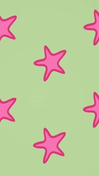 Animation of pink starfish spinning on green background