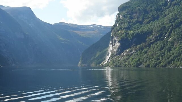 Distant Seven Sisters waterfall between fjord walls, Geirangerfjord, More og Romsdal, Norway