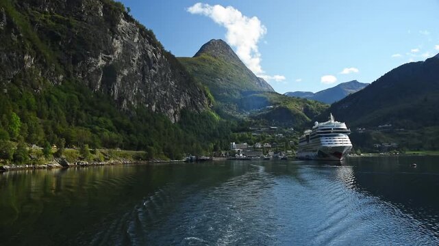 Geiranger village and moored cruise ship on the fjord, More og Romsdal, Norway