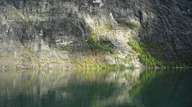 Brudesloret waterfall threading down grey cliffs, Geirangerfjord, More og Romsdal, Norway