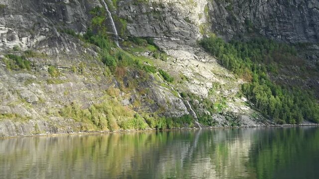 Brudesloret waterfall above the fjord shoreline, Geirangerfjord, More og Romsdal, Norway