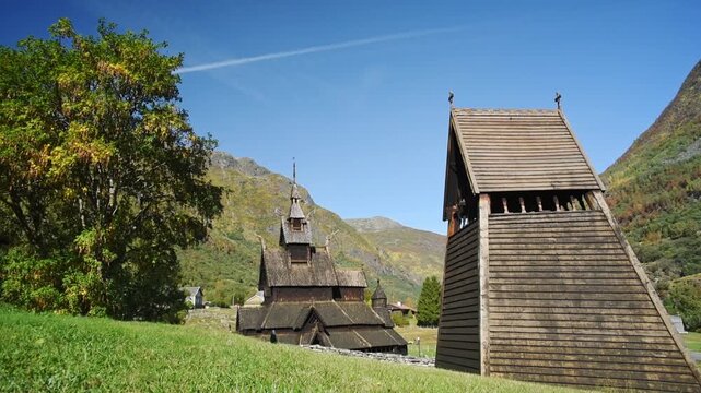 Freestanding bell tower and Borgund Stave Church on grass, Laerdal, Vestland, Norway