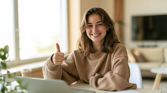 Relaxed home office setup: focused learner enjoying remote education on a laptop