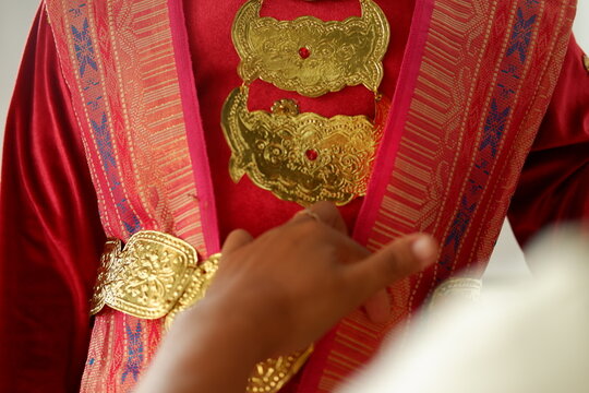 Woman wearing exquisite traditional golden jewelry and ethnic garments