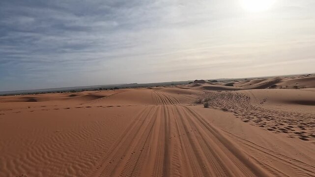 POV driving on Sandy desert track winding between dunes, Erg Chebbi, Merzouga, Draa-Tafilalet, Morocco