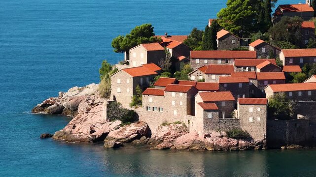 View of Sveti Stefan, a small island with Mediterranean architecture on the coast of Montenegro